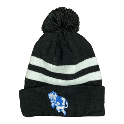Product Photo: black knit hat with a black pom on the top. two white stripes around the crown and the bull heritage logo in UB blue and white